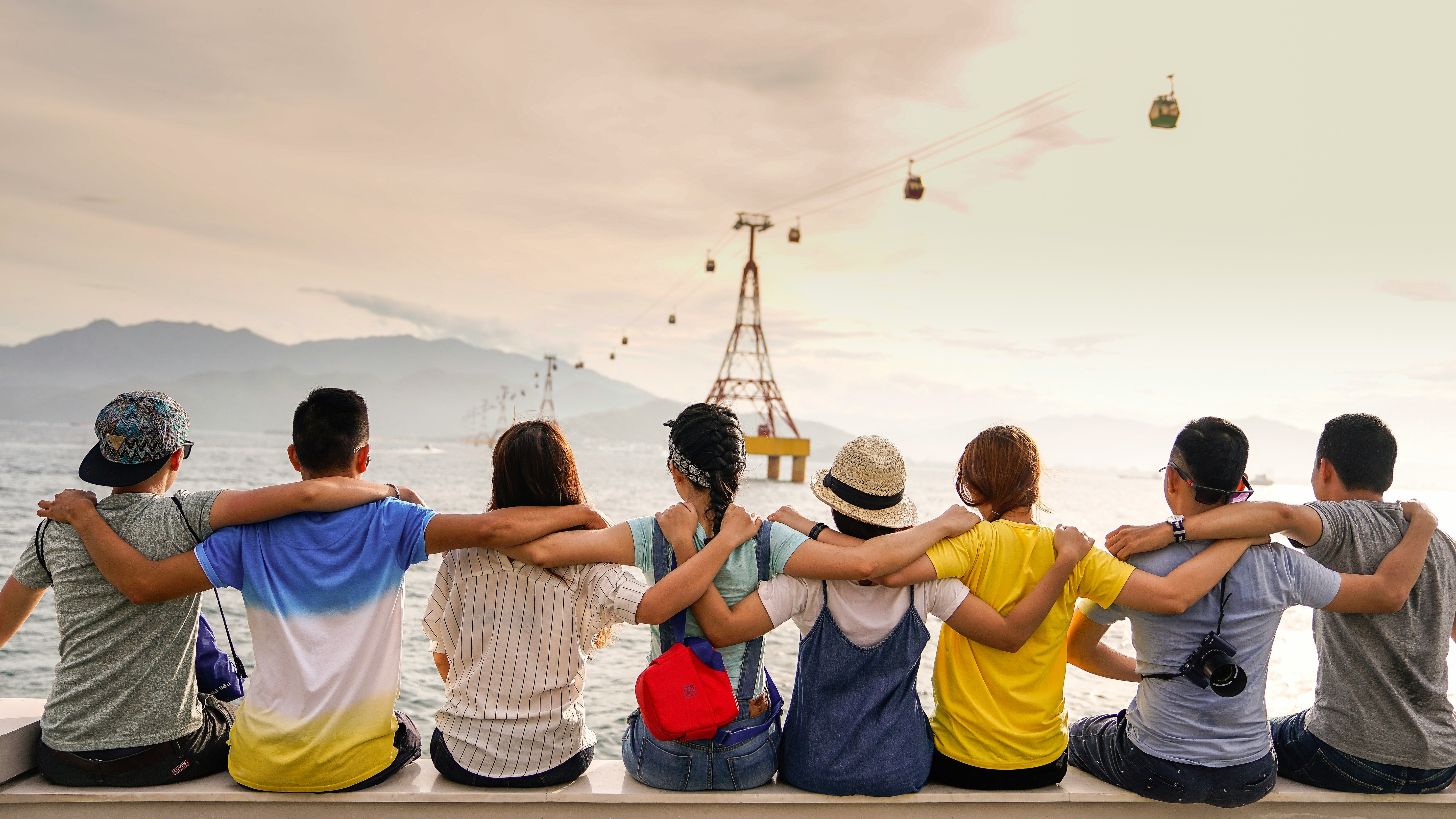 Image of a group of people with their backs to the camera looking out onto a gorgeous scene