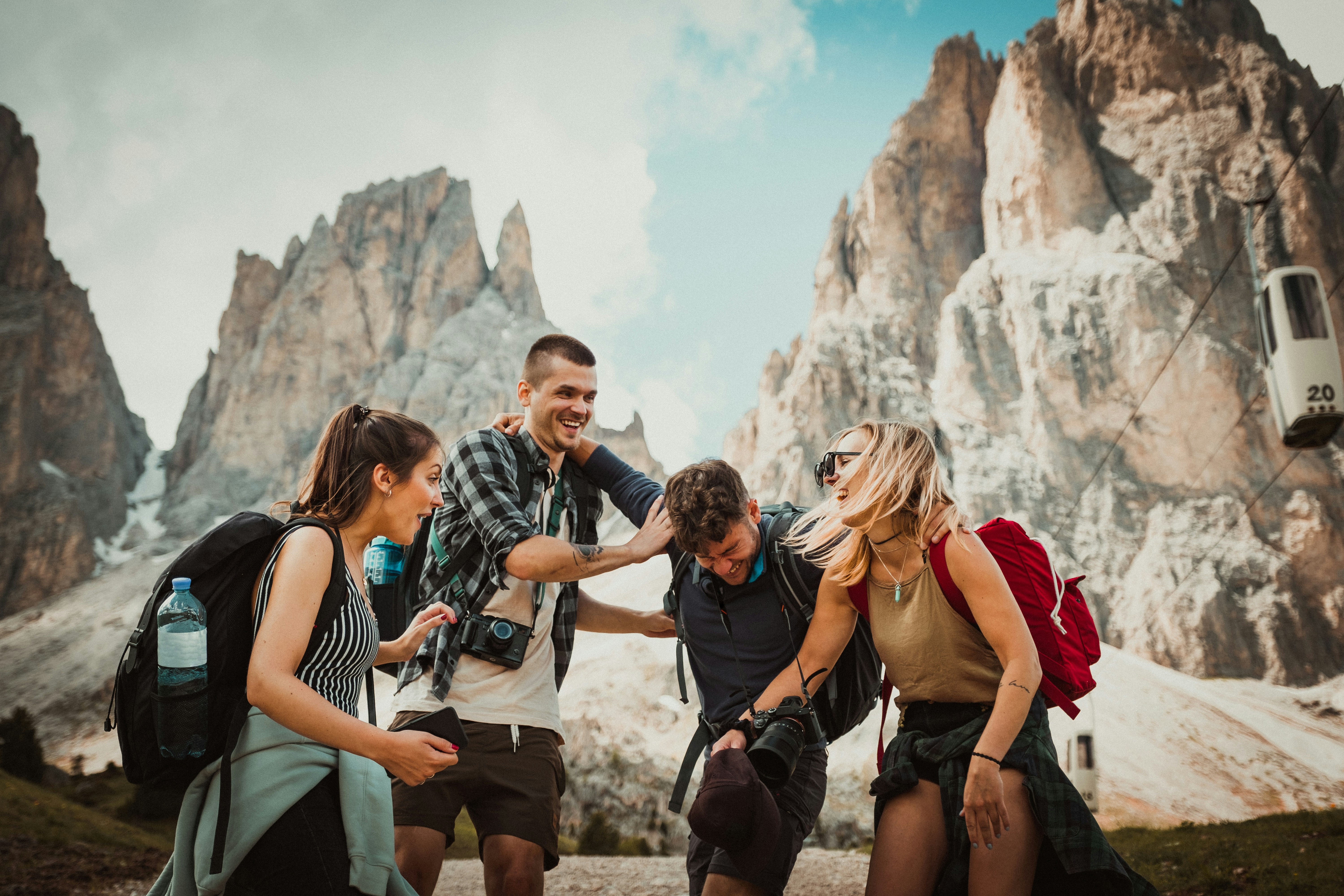 Four people hiking in the mountains on an incentive trip.